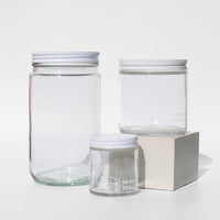 Glass jars with tare weights in various sizes