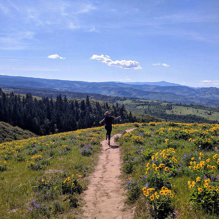 Woman frolicking on trail