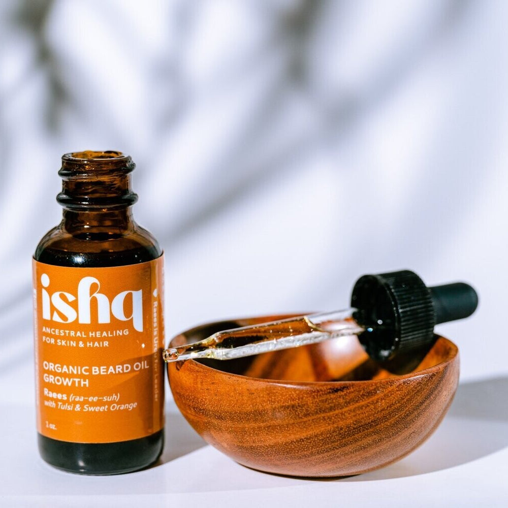 ishq organic beard oil bottle with dropper on a white background