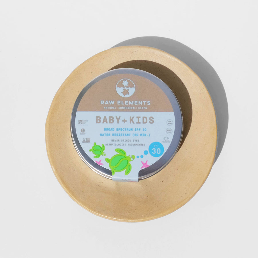 baby and kid sunscreen in metal tin