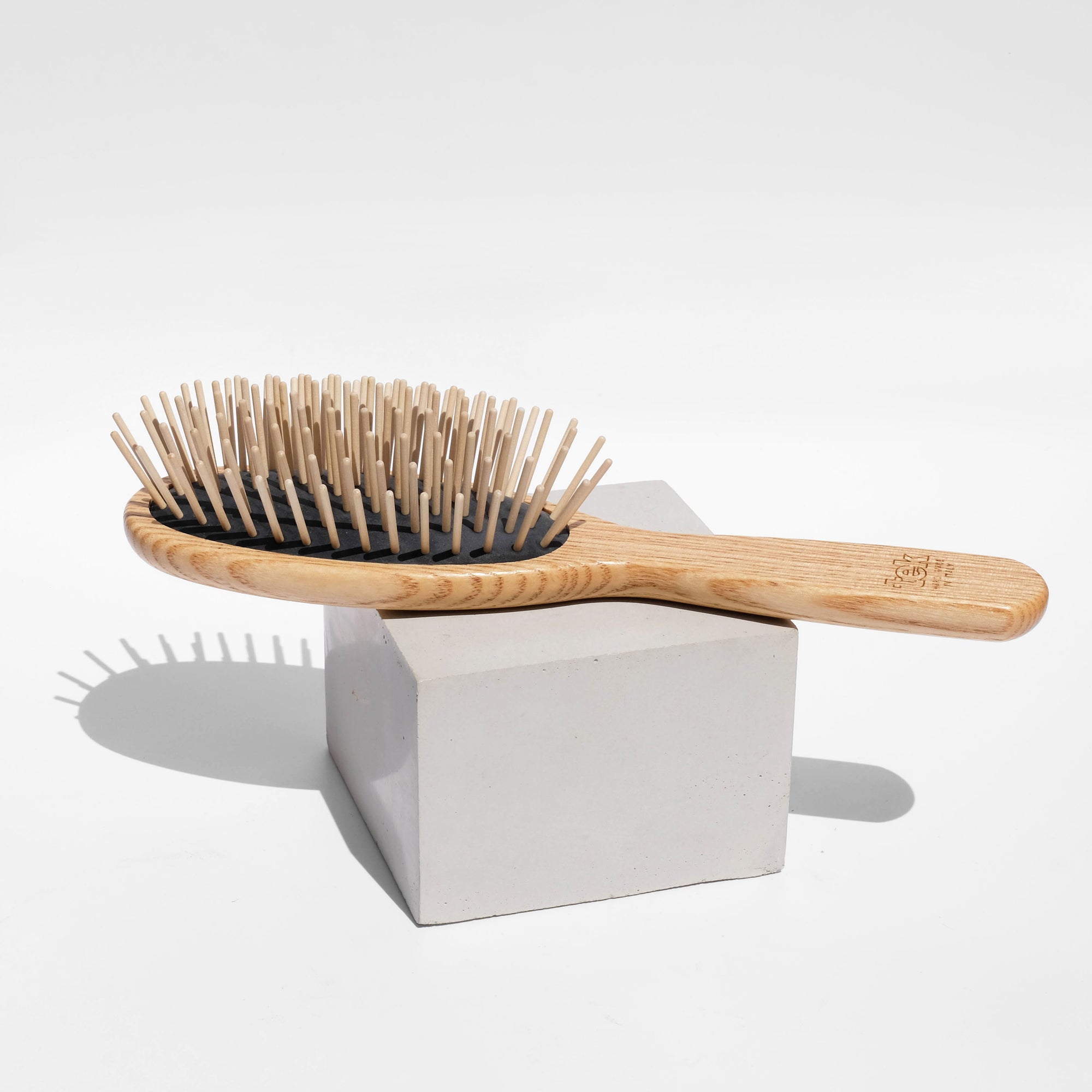 wooden hairbrush with pins